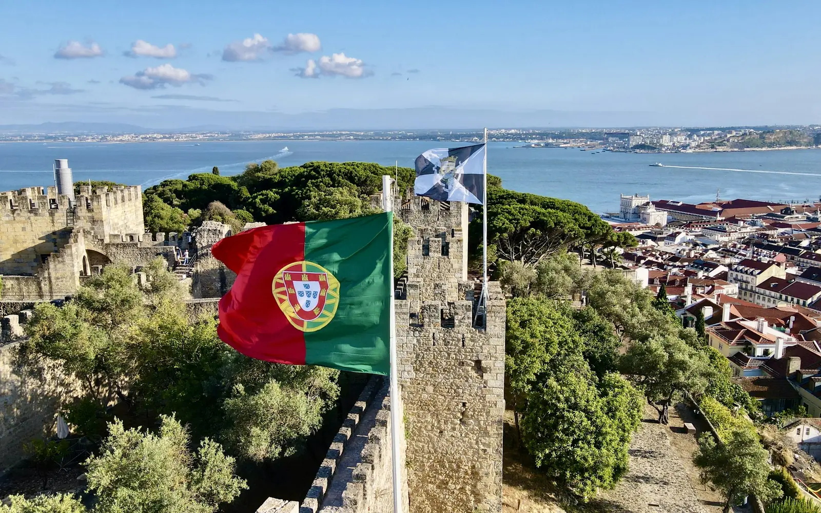 The Portuguese flag flying on the castle ramparts above Lisbon