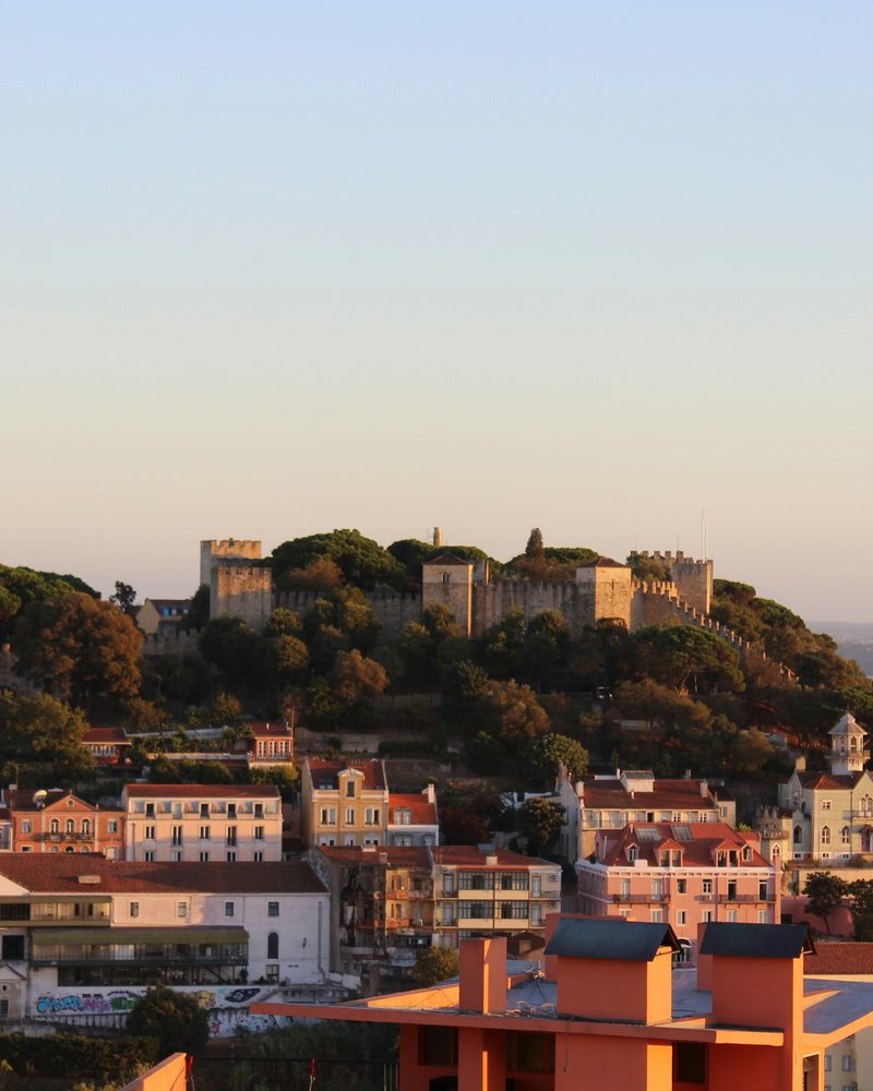 Castelo de São Jorge — the medieval hilltop castle in Lisbon, with the Tagus estuary and Alfama district visible from the ramparts